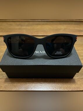 Prada Matte Black Oval Polarized Sunglasses